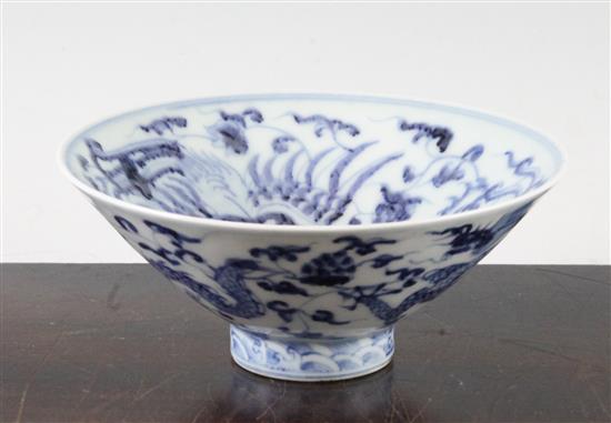 A Chinese blue and white dragon and phoenix bowl, Yongle four character mark to the interior, 15cm.